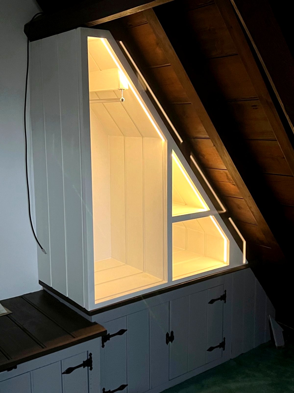 Attic shelving with built‑in lighting crafted in Wellingborough