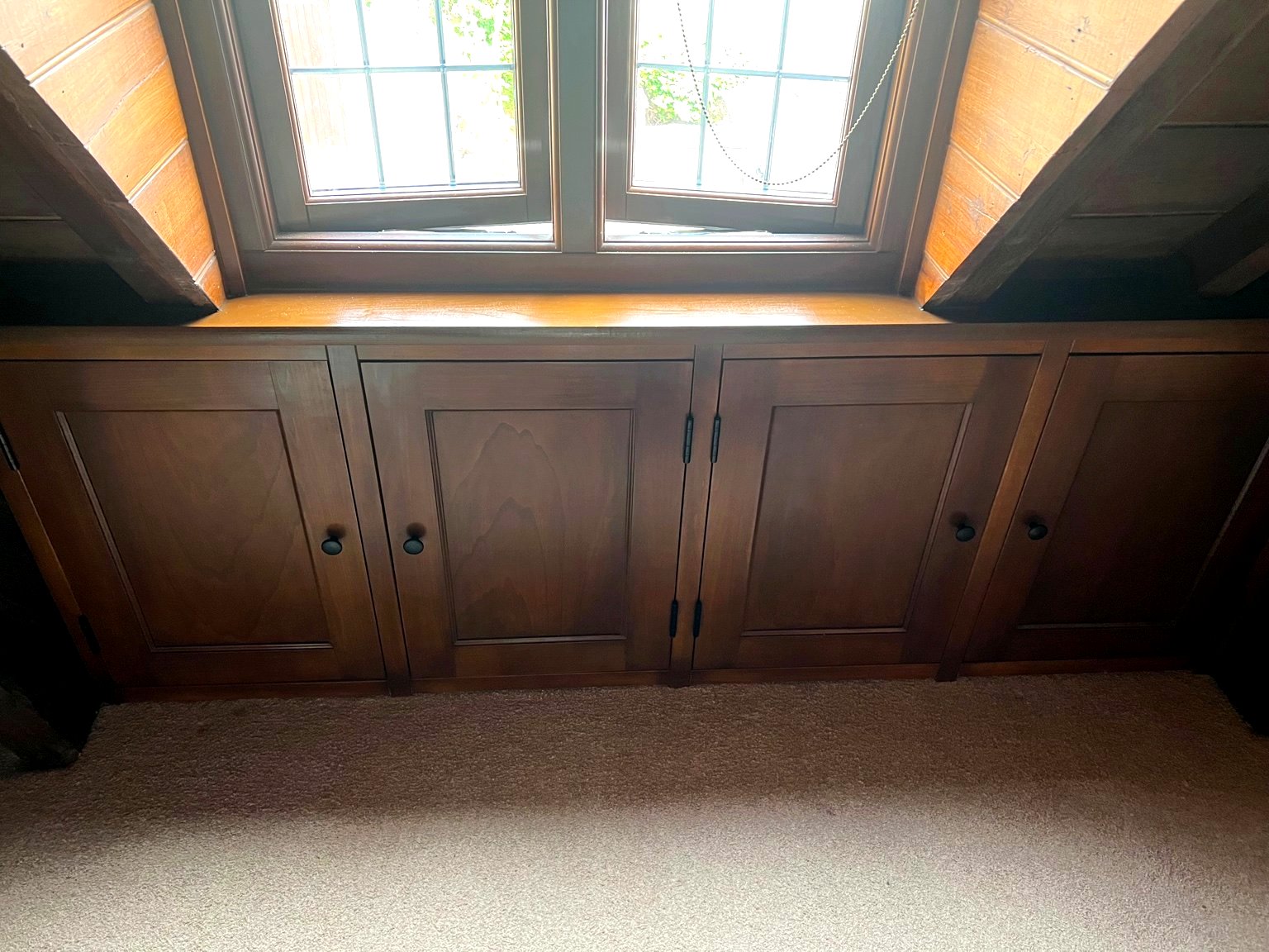 Bespoke under‑eaves storage in a Wellingborough home