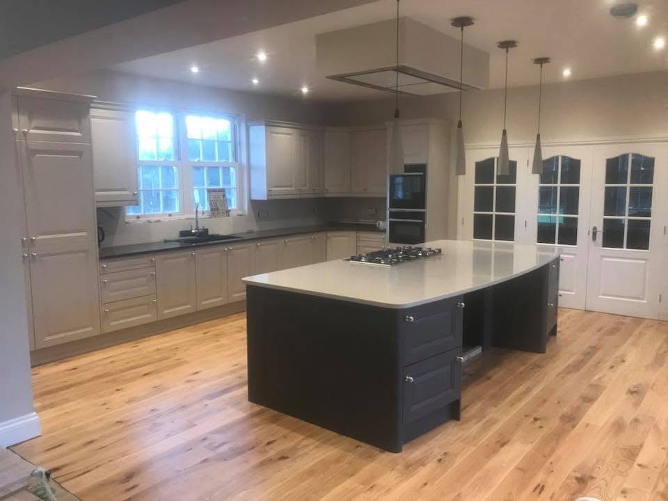 Spacious kitchen with island and overhead lighting